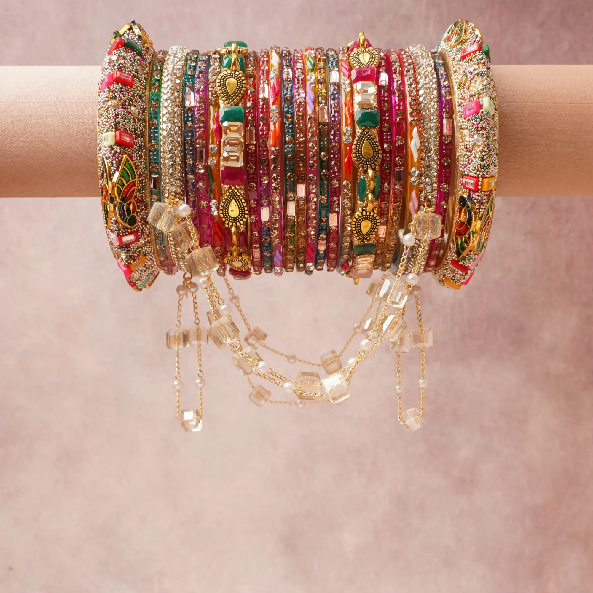 A majestic Burgundy set, complemented by Emerald Green, Fuchsia Pink, Sky Blue, Marigold Yellow, Tangerine, Clear Crystal, Pearl White, Silver, Light Rose Pink featuring Glass, Resin, Gold-toned Metal, Crystal, Simulated Pearl, Enamel, Rhinestone.
Rich, ceremonial, and designed to be passed through generations.